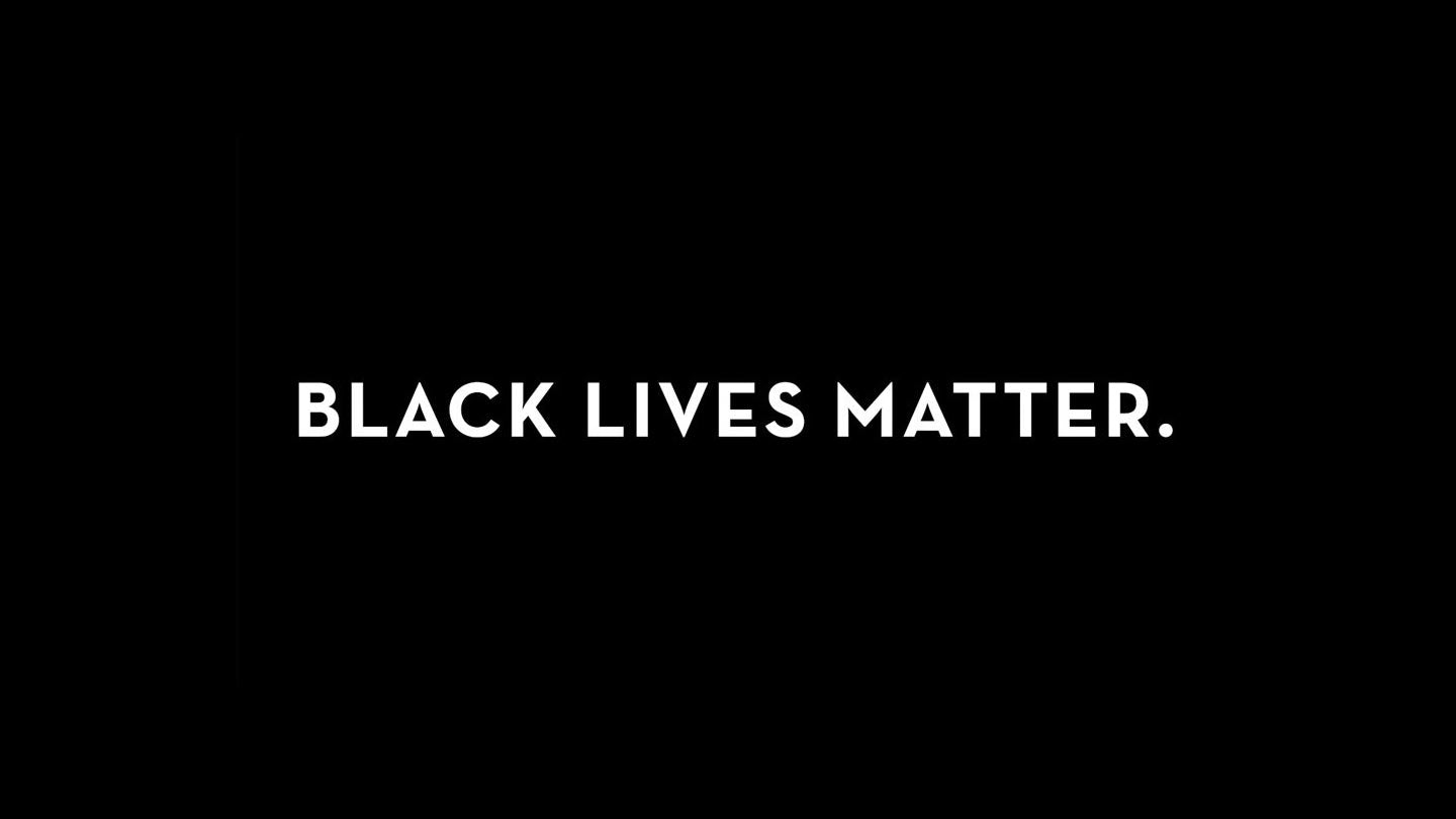 White text on a solid black background reads BLACK LIVES MATTER, showing solidarity with the Black community.