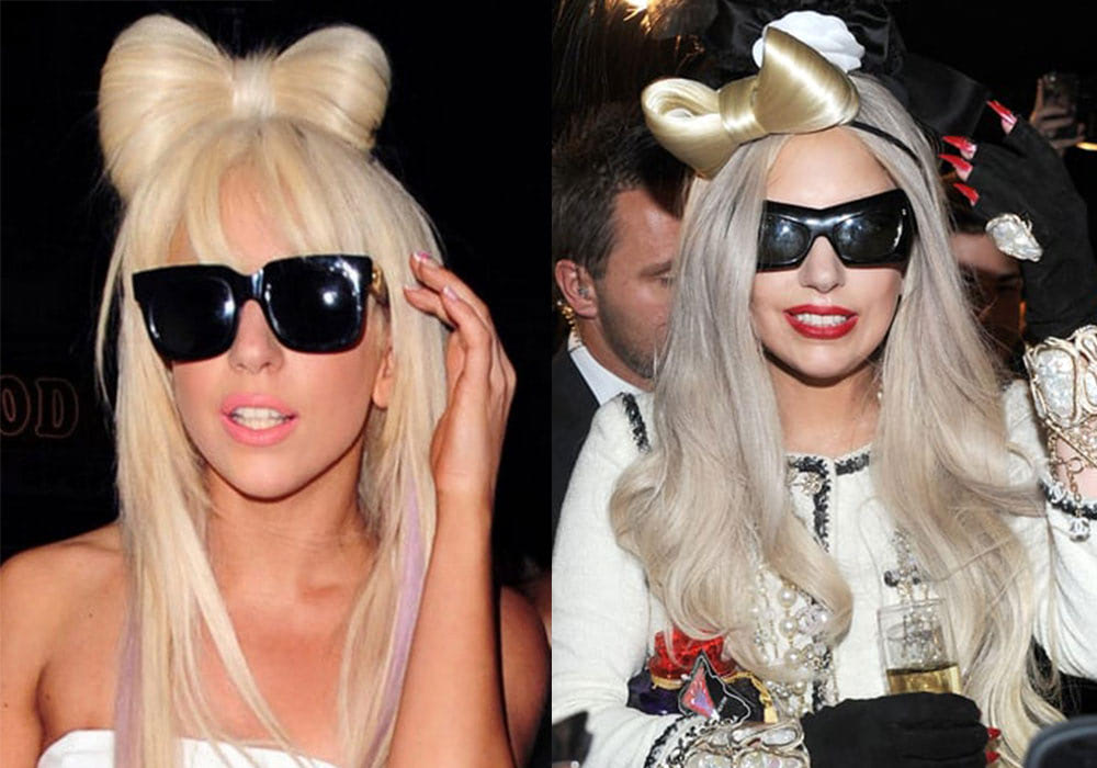 Two women with long, blonde hair and stylish hair bows wear dark sunglasses.