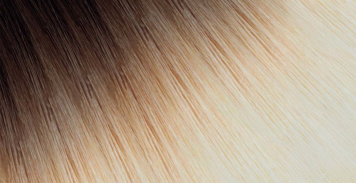 Perfect Locks rooted tape-in hair extensions with dark brown roots blending to light blonde ends