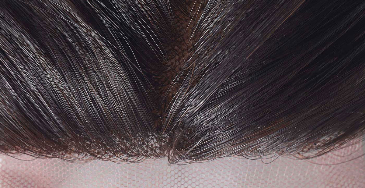 Close-up of Perfect Locks long human hair closures in dark brown showing strands on a lace base