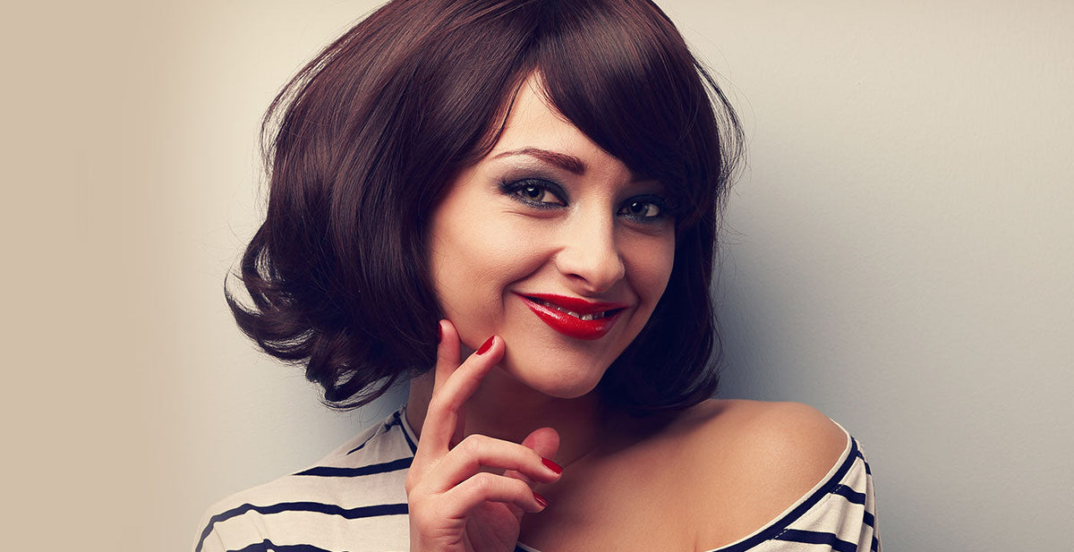Woman wearing a Perfect Locks short lace front wig with dark brown hair and red lipstick