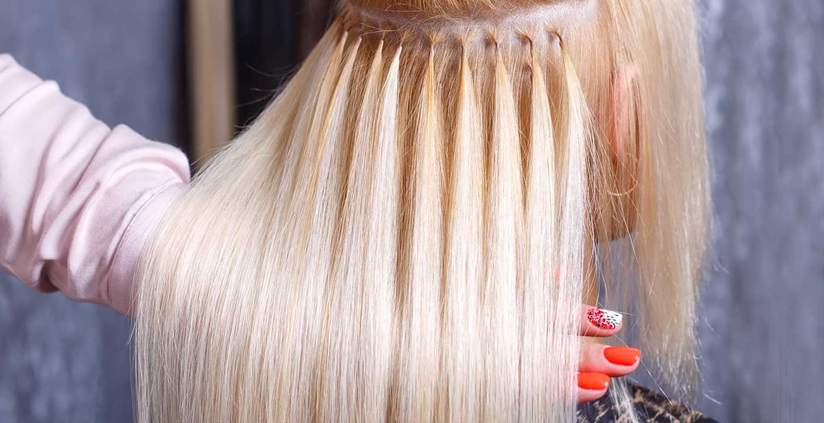 Perfect Locks semi-permanent hair extensions being expertly bonded strand by strand