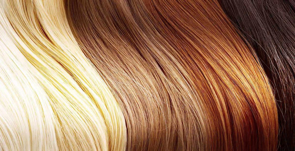 Perfect Locks colored hair extensions in a range of shades arranged to show shine and straight texture