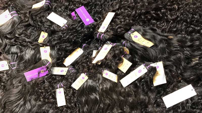Perfect Locks virgin machine weft bundle deals in curly black hair with purple branded bands