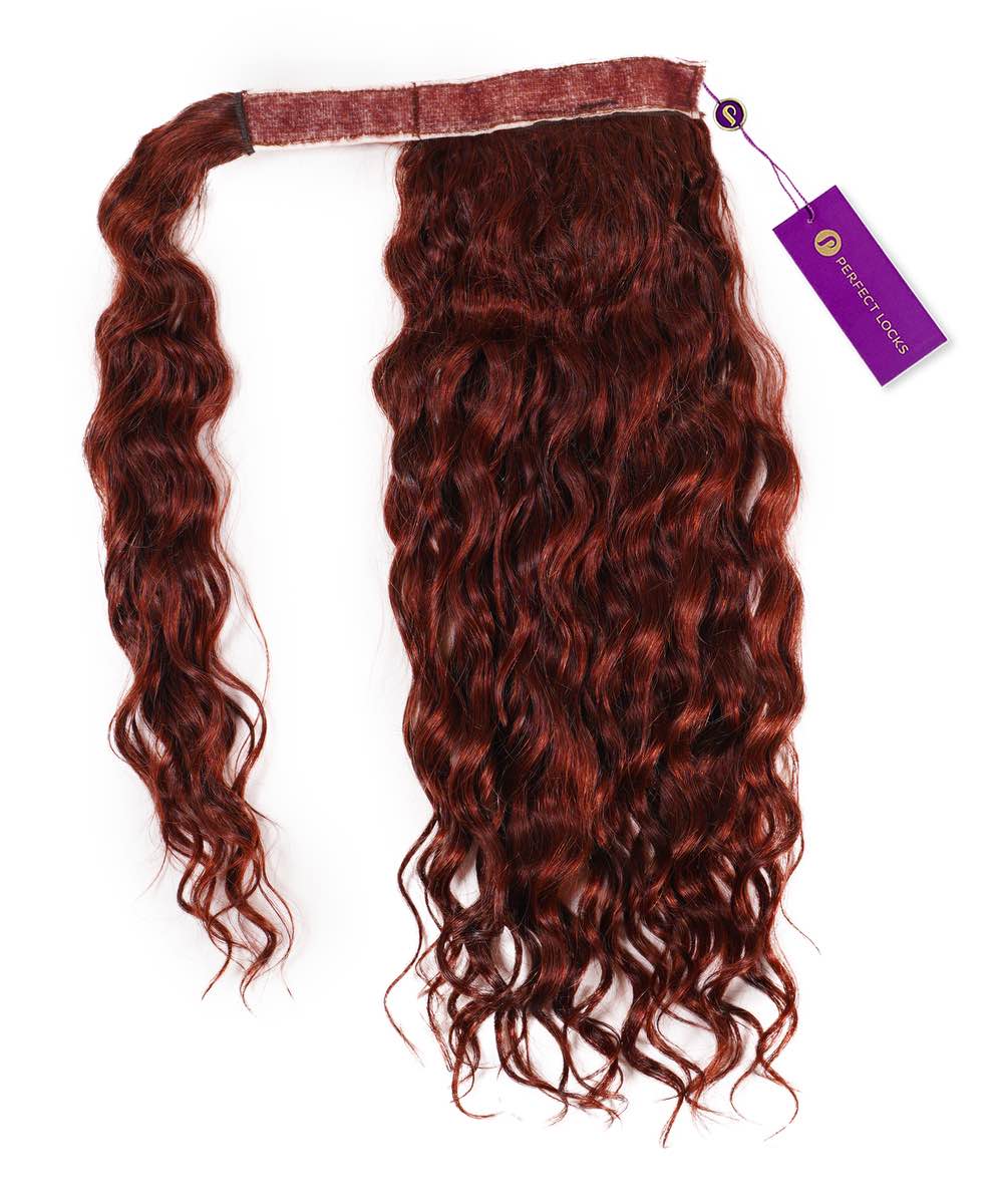 A Curly Clip-In Ponytail Extension by Perfect Locks in Dark Auburn on a white background, with a sewn top band and attached purple product tag.#color_dark-auburn-(33)