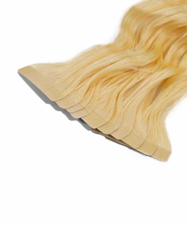 platinum blonde (613) curly tape in hair extensions by Perfect Locks