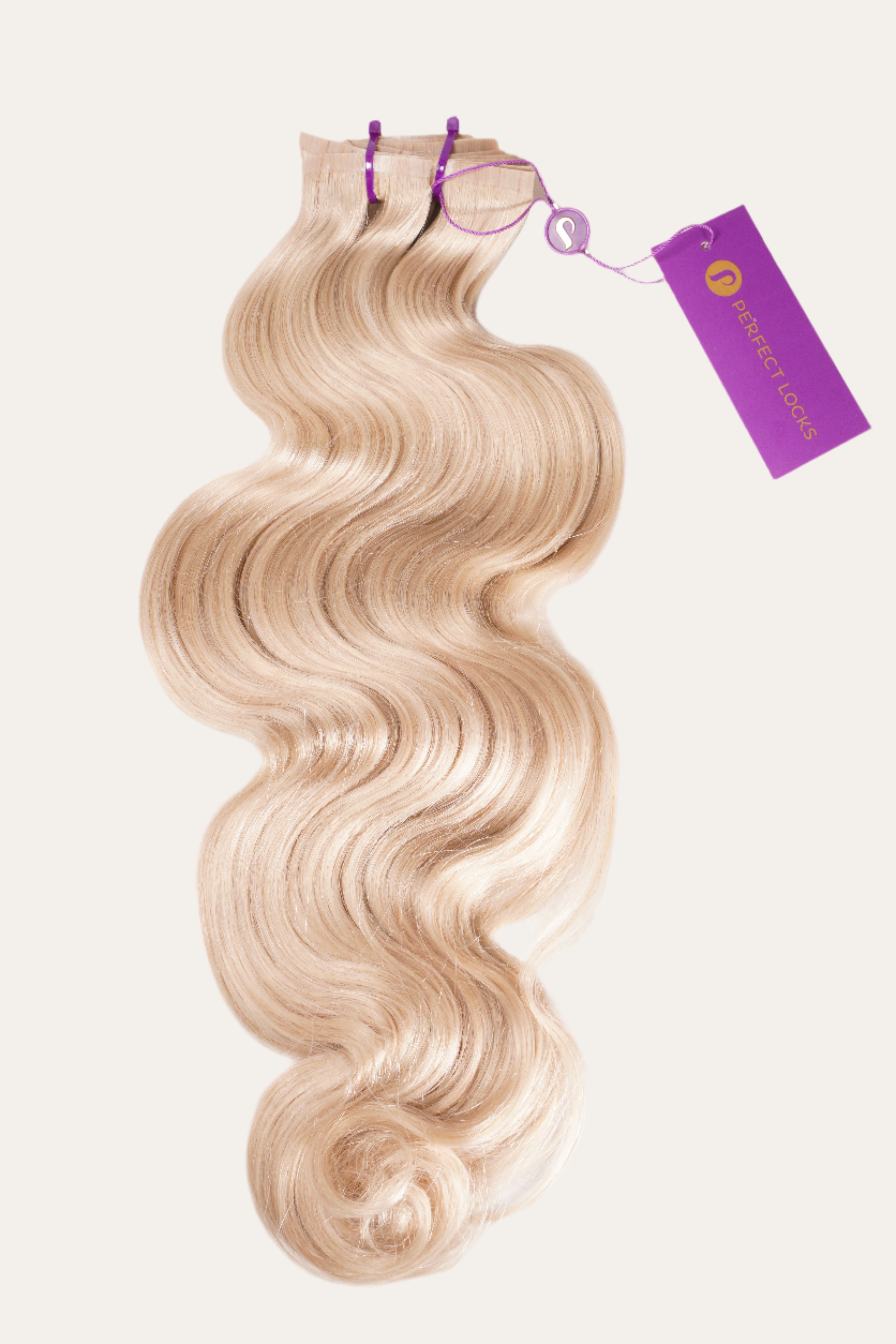 A bundle of wavy, blonde hair extensions secured with two purple bands and a Perfect Locks tag on a plain white background.