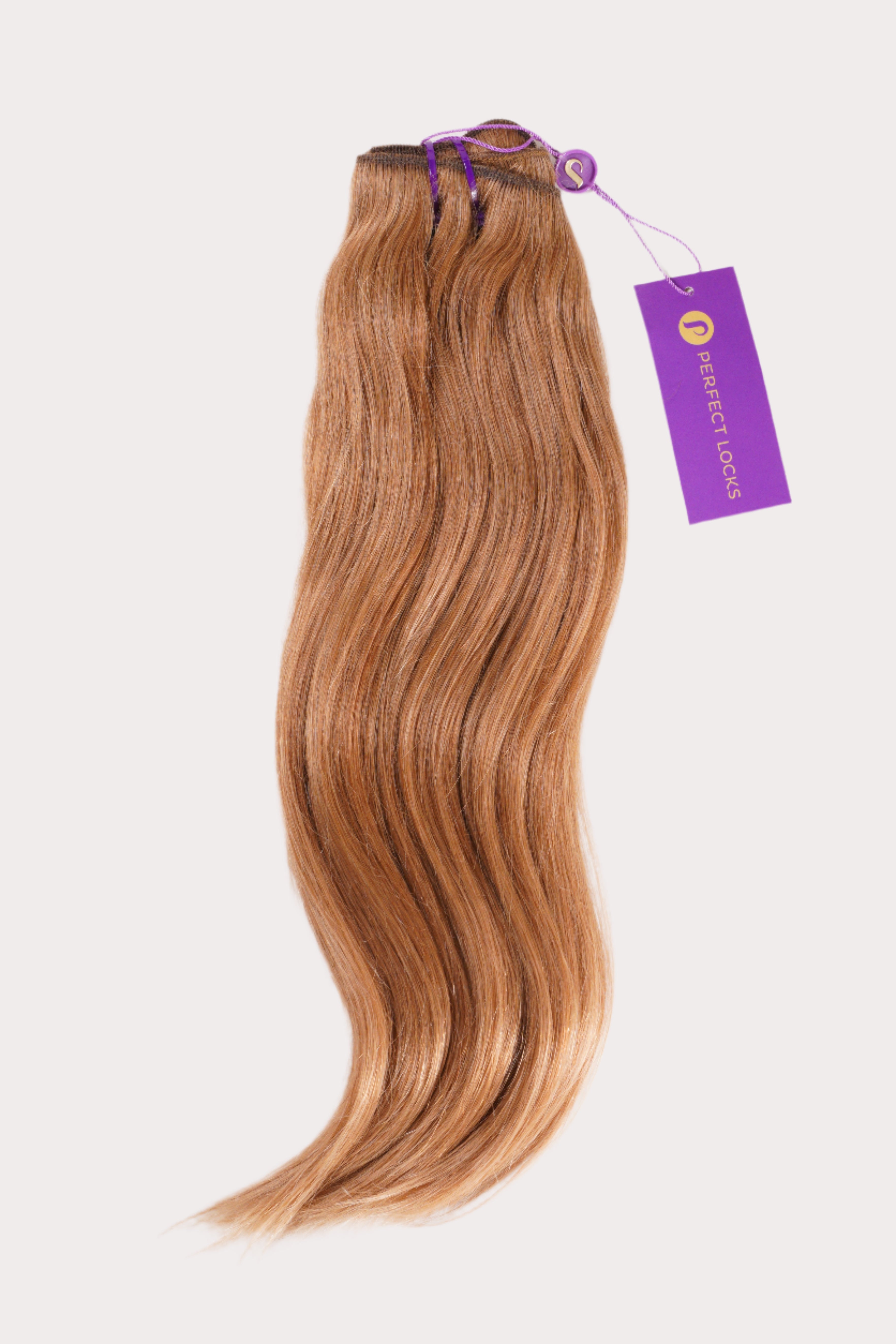 A bundle of long, wavy, light brown hair extensions tied with a purple ribbon and Perfect Locks tag against a white background.