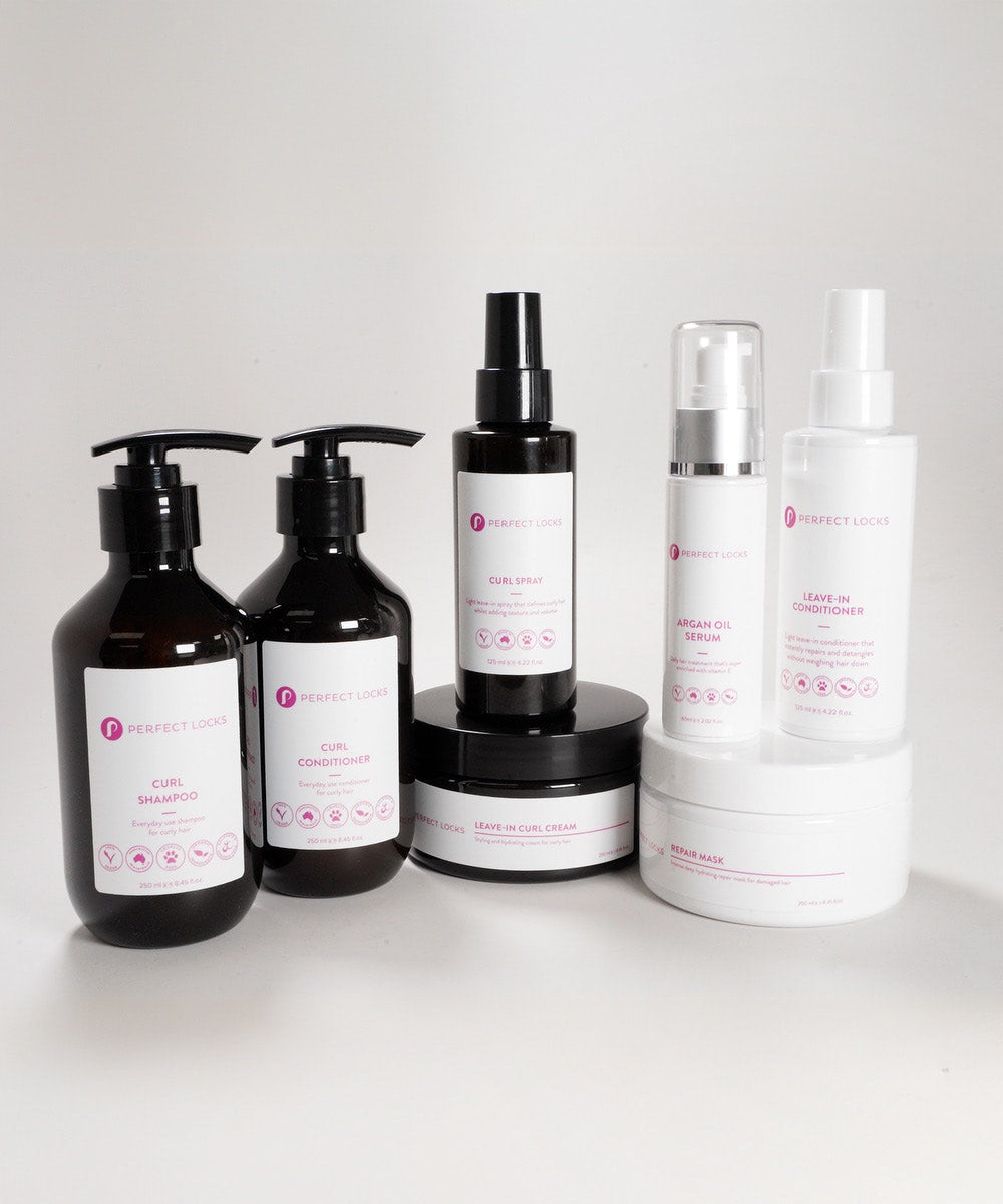 The Perfect Locks Dry Curly Hair Reviver Bundle includes shampoo, conditioner, spray, creams, serum, mask, and leave-in.
