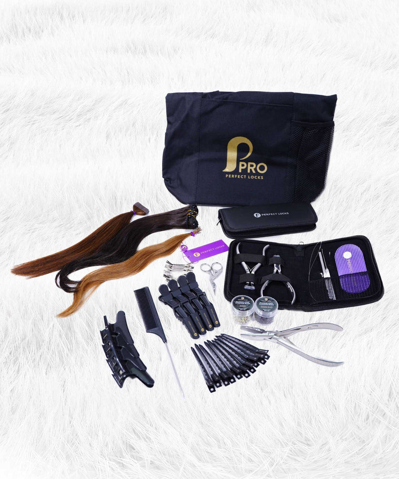 A hair extension starter kit on white fur with a black bag, extensions, clips, scissors, comb, pliers, thread, and tools.