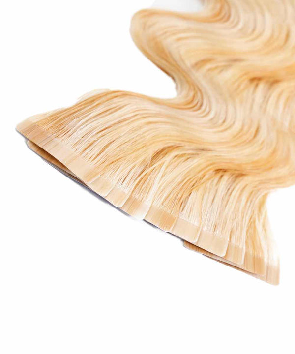caramel blonde highlights (24/27/613) wavy tape in hair extensions by Perfect Locks