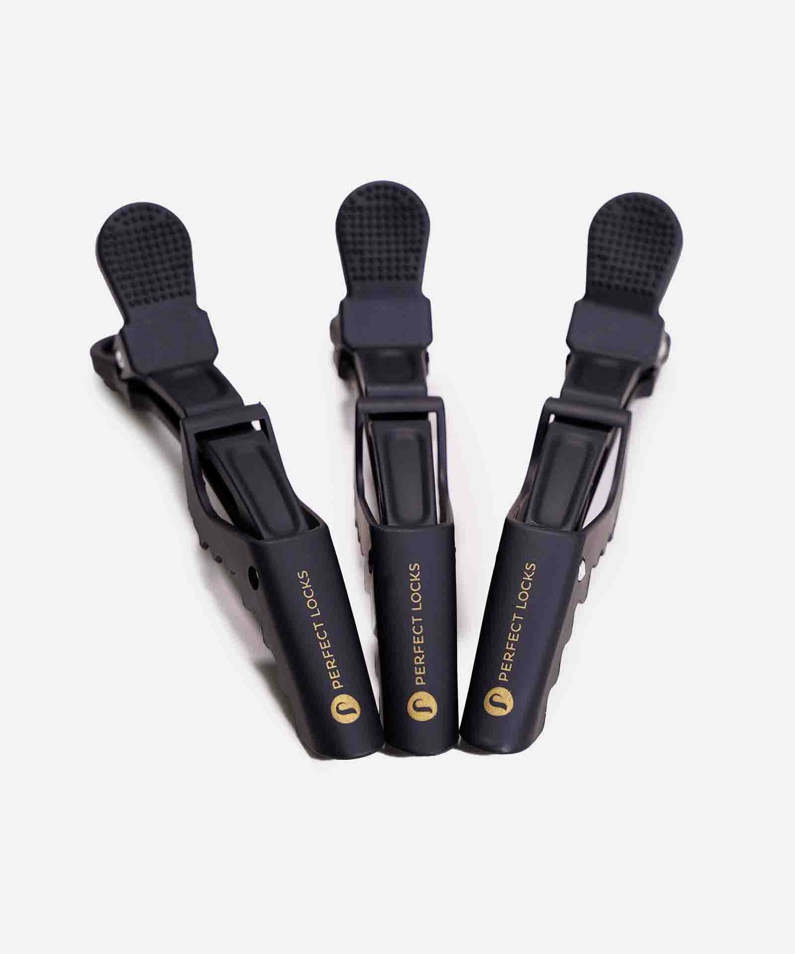 Three black Perfect Locks hair sectioning clips, featuring the brand's signature durability, arranged in a fan shape on white.