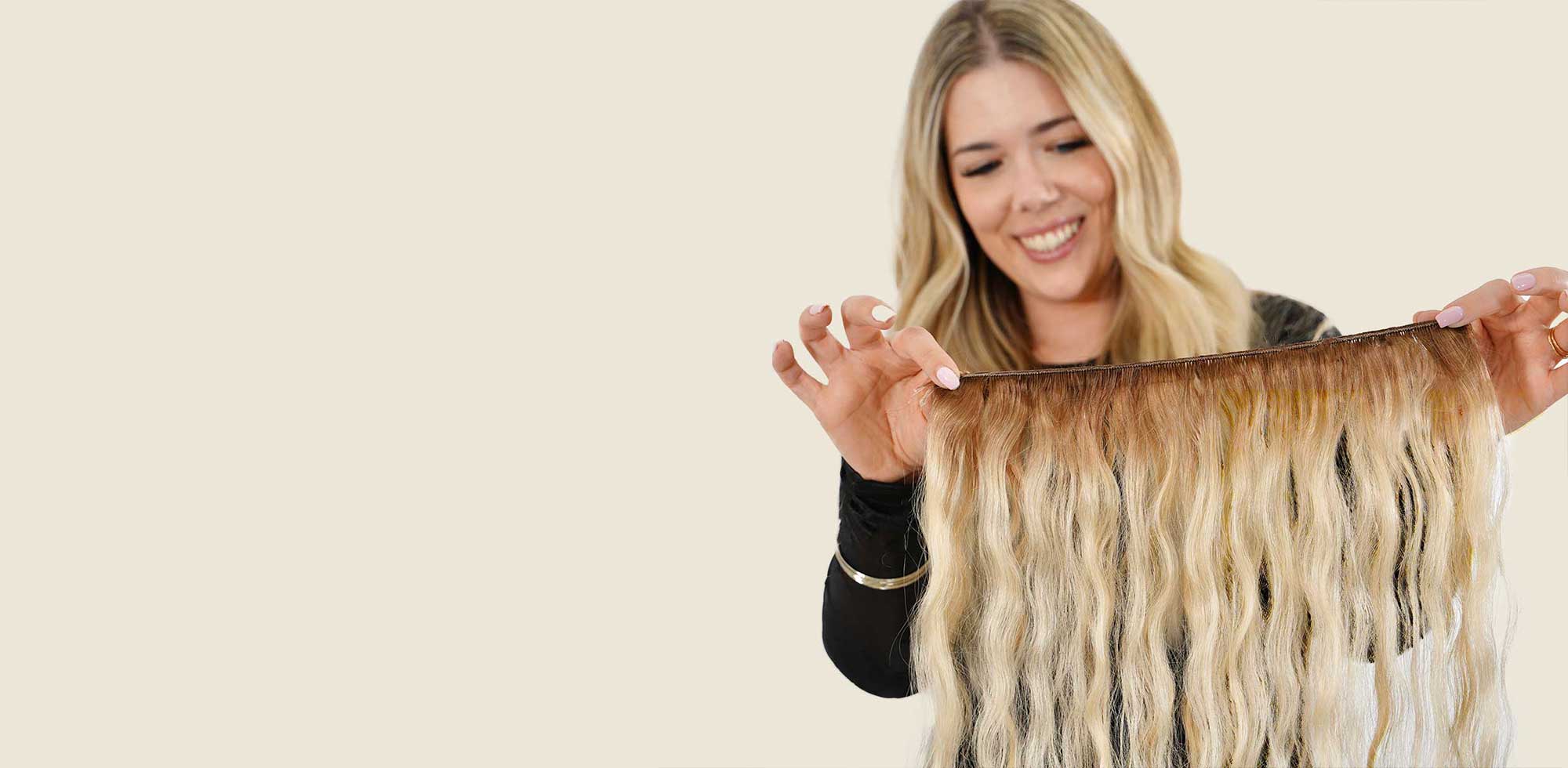 hair stylist holding hand tied weft