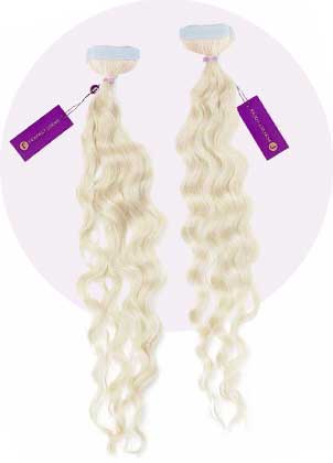 Two bundles of long, wavy platinum blonde hair extensions with purple tags on a pale background add length and volume for glamour.