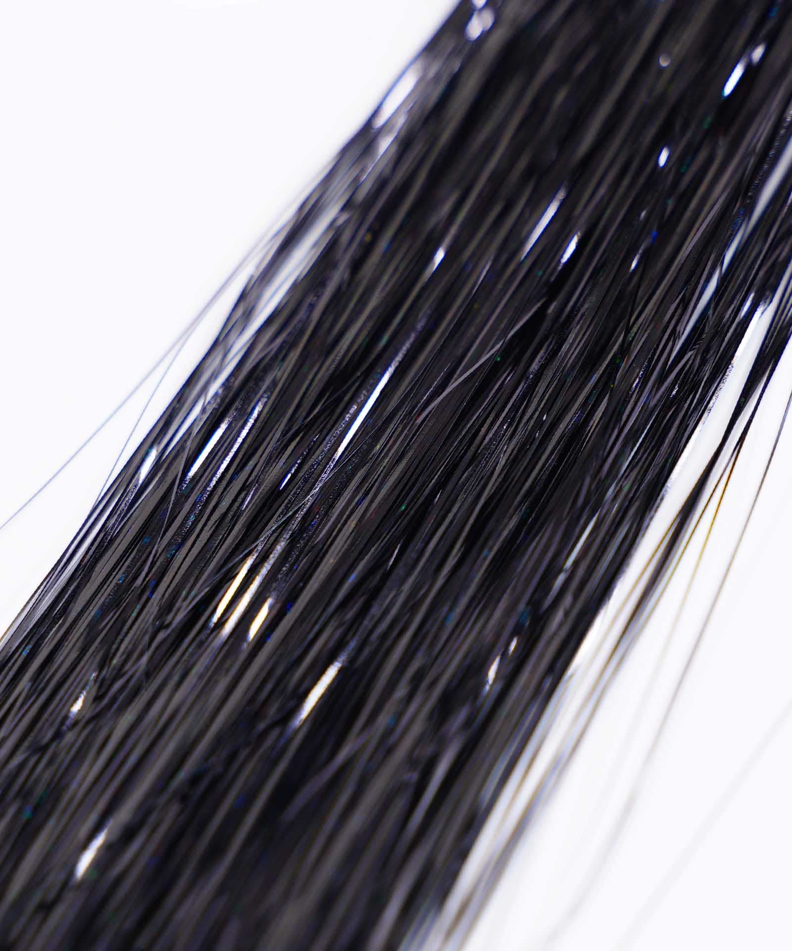 Close-up of multiple long, thin, shiny bronze strands of Perfect Hair Tinsel by Perfect Locks grouped together against a white background.#color_black