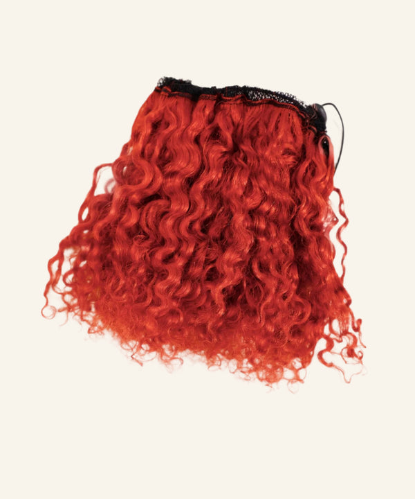 The Perfect Locks Kinky Curly Clip-In Bun in vibrant red features textured curls and a black lace weft on a simple, light background.#color_red