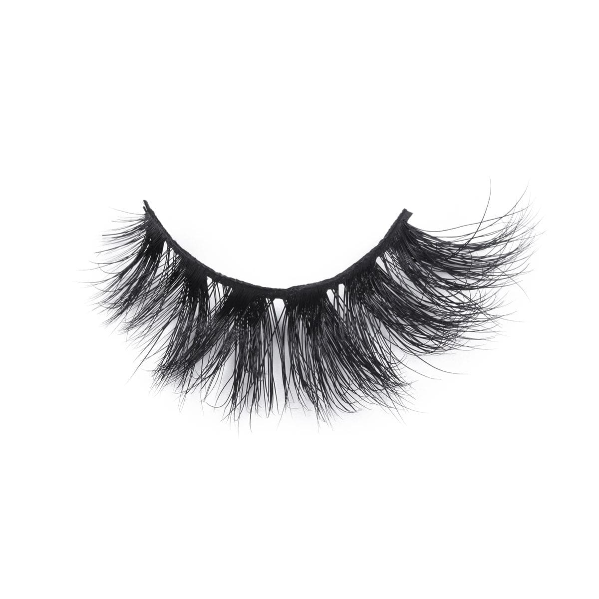 A single strip of dramatic, thick, black false eyelashes with long, wispy fibers creates a bold look on a white background.