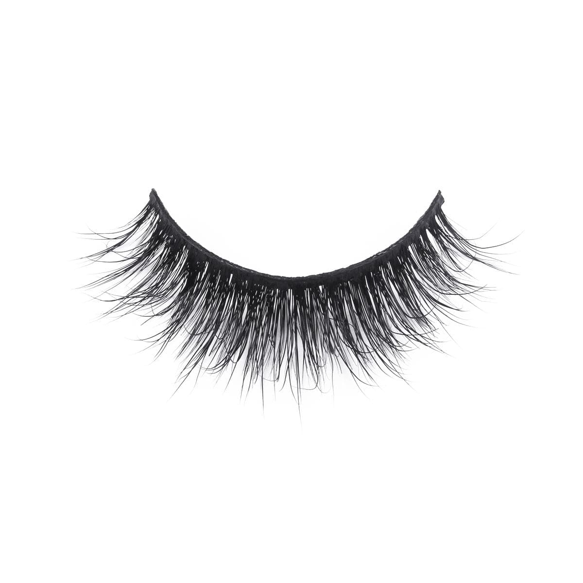 A single strip of black false eyelashes with mink-like, long, wispy, voluminous fibers arranged in a natural curve on white.