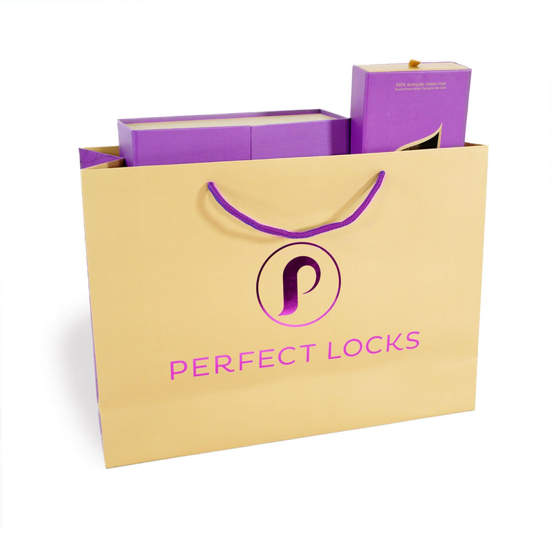 The Perfect Locks Shopping Bag has a beige design, purple handles, and is filled with elegant purple boxes for hair extensions.