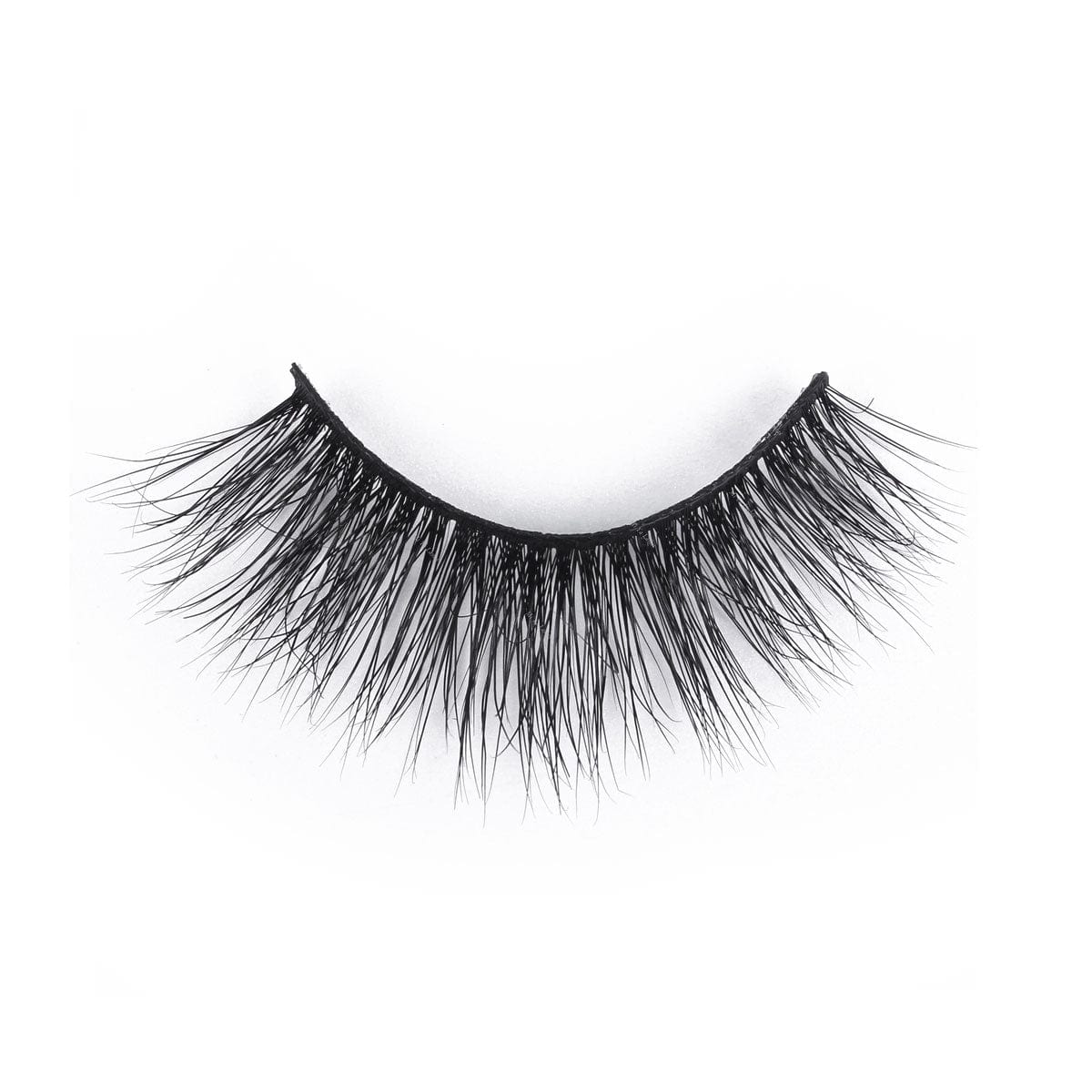 A single strip of bold, black false eyelashes with long, dense, and wispy strands showcased on a white background.