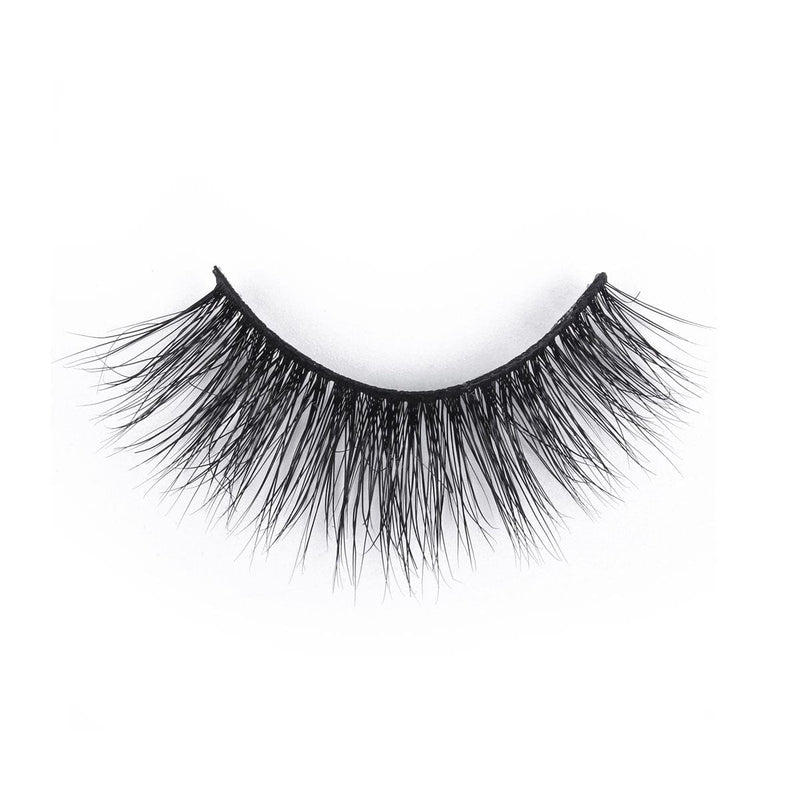 A single strip of bold, black false eyelashes with long, dense, and wispy strands showcased on a white background.