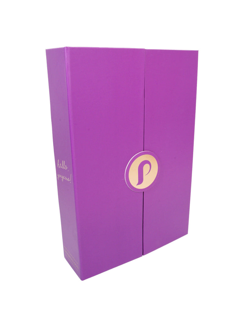 The closed Perfect Locks Wig Storage Box, a purple rectangular container with a circular logo and "hello, gorgeous!" rests on white.