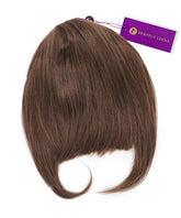 The Perfect Locks Clip-In Bangs in Chocolate Brown  have a curved, side-swept style and a purple Perfect Locks tag on top.#color_chocolate-brown-(3)