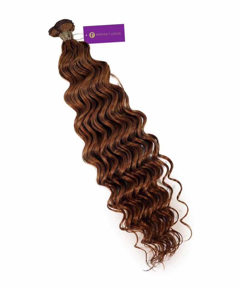 A bundle of Perfect Locks Curly Hybrid Weft Hair Extensions in Golden Brown  with loose waves and a purple tag on top.