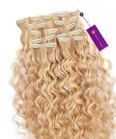 Curly Seamless Clip-In Hair Extensions by Perfect Locks in Pearl Bronde Balayage with loose waves and a purple tag at the top right.#color_highlighted-pearl-blonde-(8/26/613)