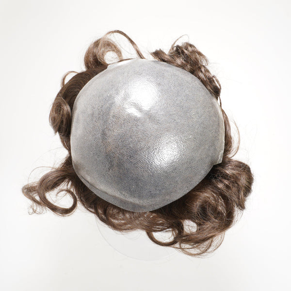 The Perfect Locks Wavy Men's Unit in Dark Ash Brown features wavy hair attached to a shiny, round, grayish base, shown from above on a white background.