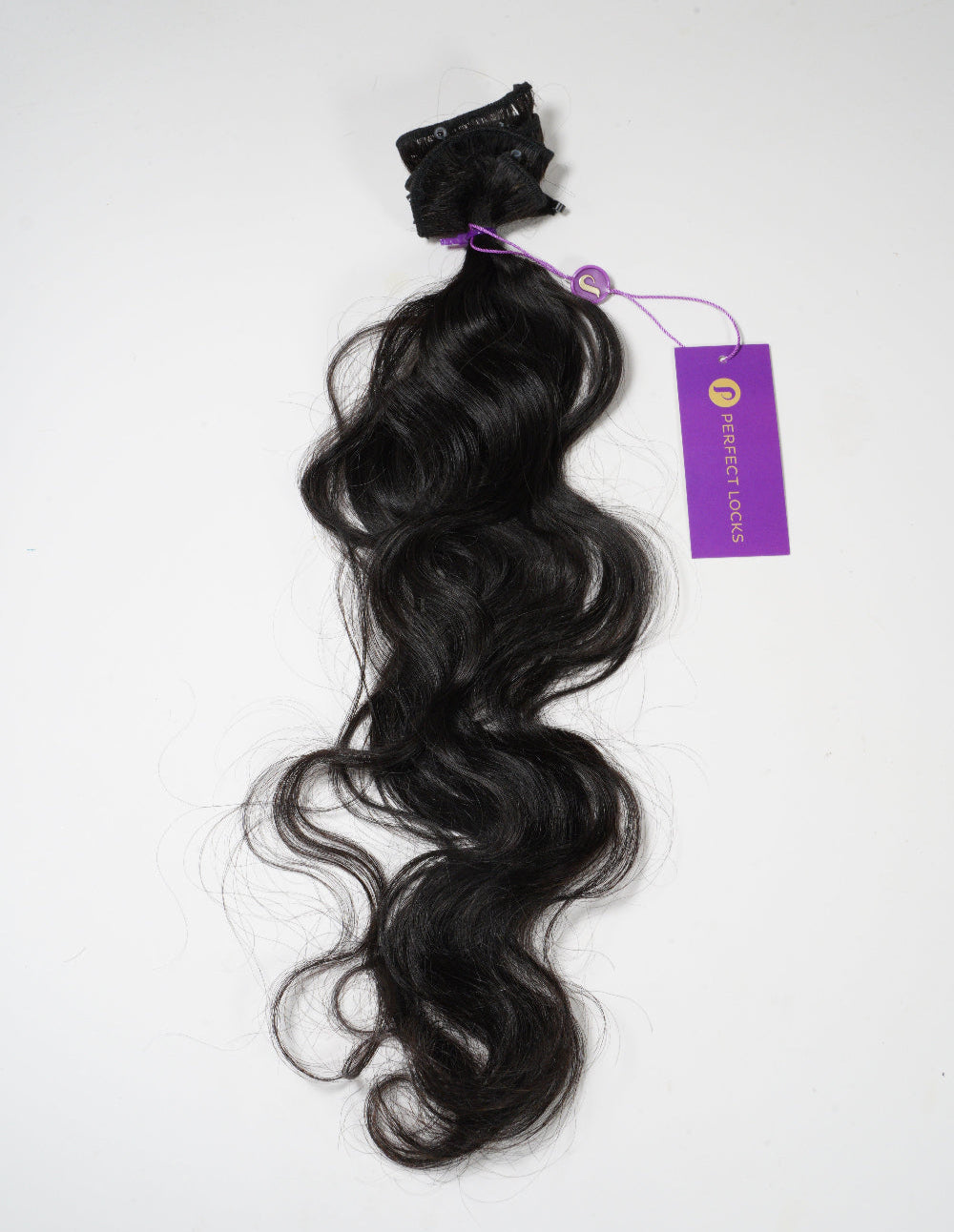 Black hair extensions with a purple tag on a white background