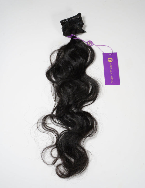 Black hair extensions with a purple tag on a white background