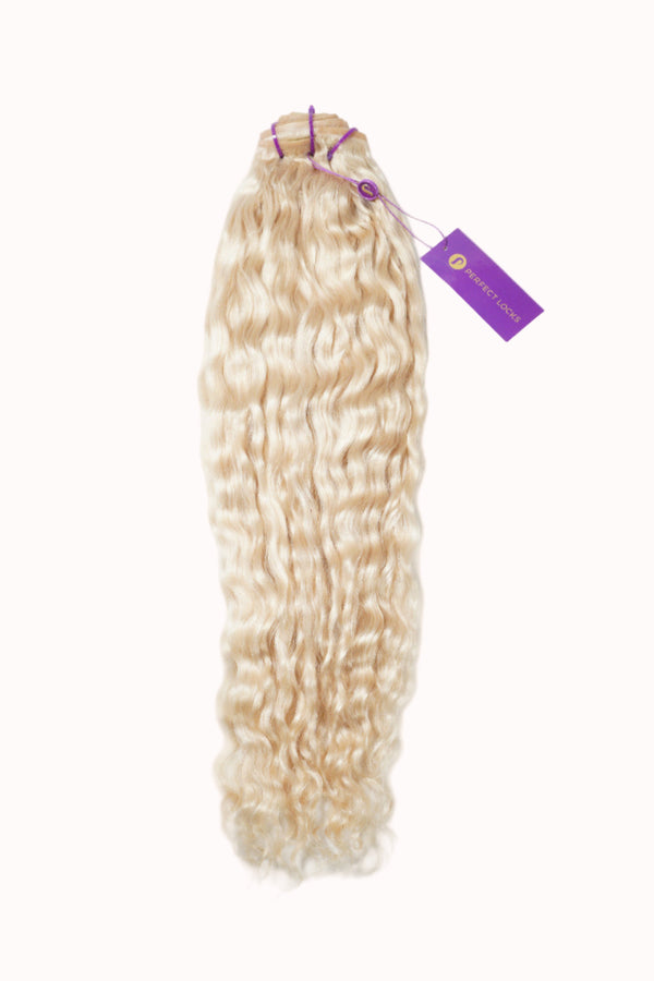 Long, wavy, light blonde hair extensions secured with purple bands and a purple tag, perfect for adding volume and length to your look.
