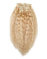 Blonde, wavy clip-in hair extensions with multiple clips, fanned out for easy application on a white background.