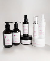 The Perfect Locks Dry Curly Hair Reviver Bundle includes shampoo, conditioner, spray, creams, serum, mask, and leave-in.