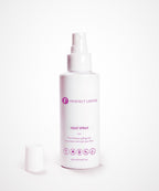 A white spray bottle labeled Perfect Locks Perfect Heat Protection Spray with purple text sits on a plain background; 125ml size.