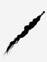 A single long, wavy black hair extension bundle tied at one end with a red band, perfect for adding length and volume.