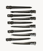 Ten black hair extension clips with PERFECT LOCKS branding are neatly arranged in rows on a white background, showing sleek design and secure grip.
