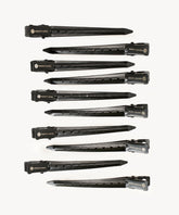 Ten black hair extension clips with PERFECT LOCKS branding are neatly arranged in rows on a white background, showing sleek design and secure grip.