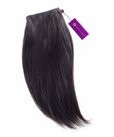 A bundle of Perfect Locks Relaxed Straight Steam Permed Machine Weft hair extensions in Natural Black  with a purple tag, on white.