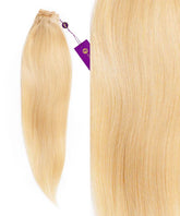 Perfect Locks Straight Hand-Tied Weft Rows in Rooted Toasted Blonde (2/613), sleek strands with a purple tag, showcase smooth, high-quality Platinum Blonde Remy hair extensions.#color_platinum-blonde-(613)