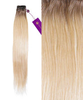 A bundle of Perfect Locks Straight Hand-Tied Weft Rows in Warm Mocha Lowlights with sleek Remy hair and a purple tag.#color_rooted-cocoa-blonde-(18/613)