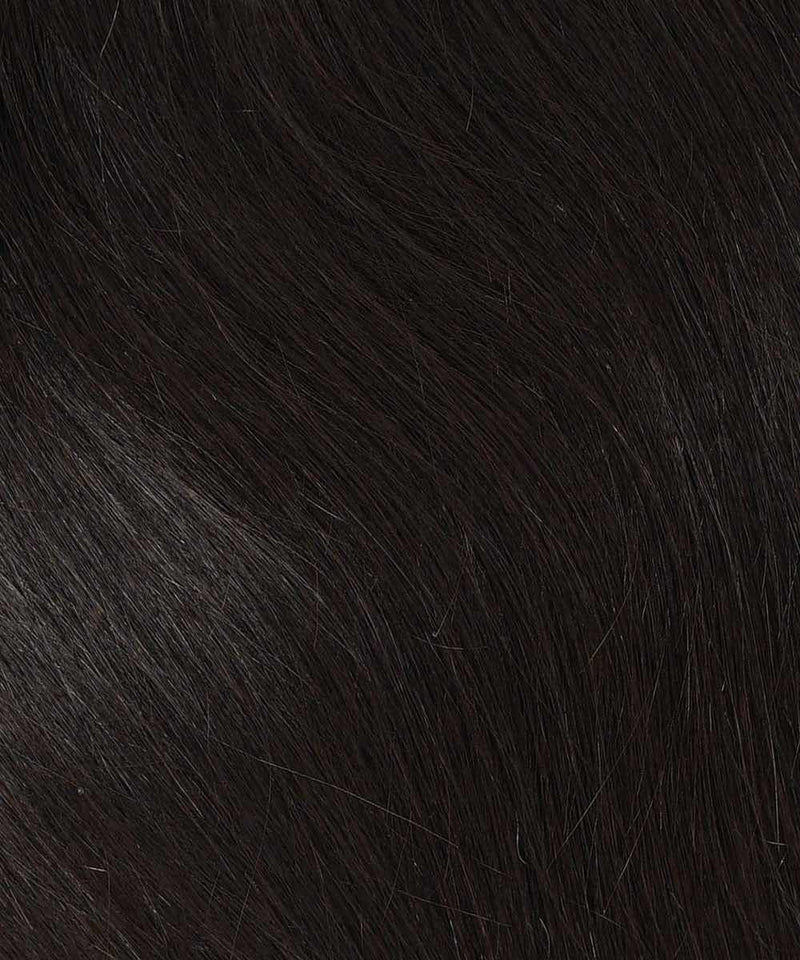 Close-up of natural black, straight hair with fine strands and natural shine, showcasing Perfect Locks' Straight Human Hair Crown Topper.