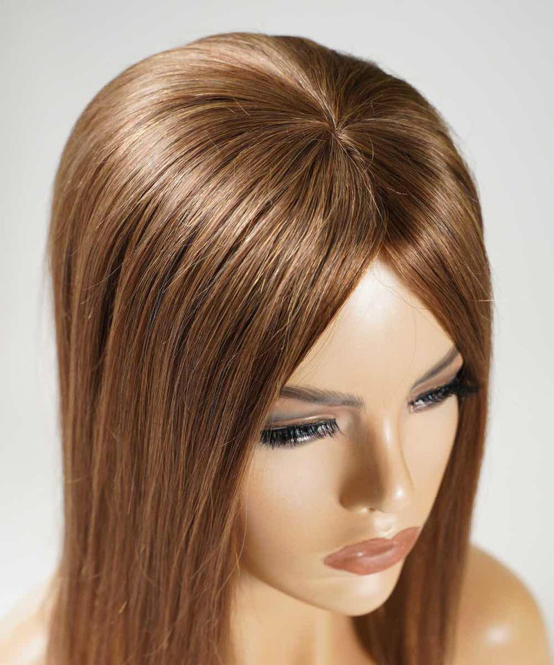 The Perfect Locks Straight Human Hair Crown Topper in golden brown on a mannequin head with realistic features and long lashes.