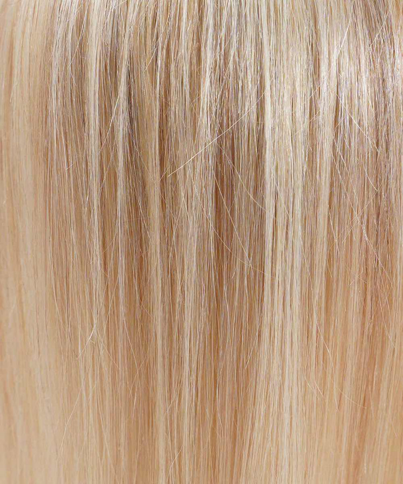 Close-up of Perfect Locks Straight Human Hair Crown Topper in highlighted blonde, featuring fine, smooth strands with a shiny, healthy look and even light reflection.