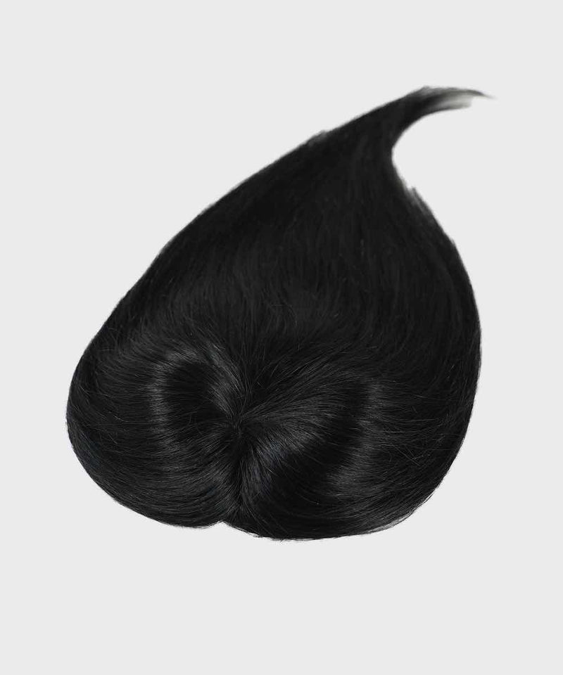 The Perfect Locks Straight Human Hair Crown Topper in jet black on a light gray background, featuring a natural hair swirl and silky texture.