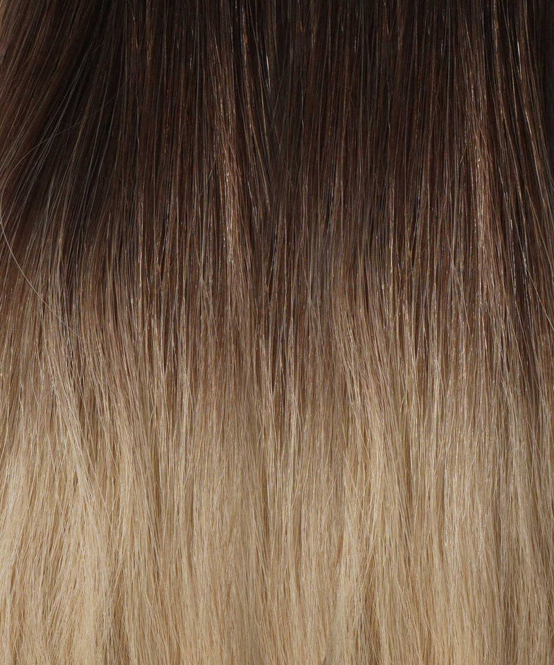 Close-up of straight hair with champagne highlights, smoothly transitioning shades and enhanced by Perfect Locks Straight Hybrid Weft Hair Extensions for a natural look.