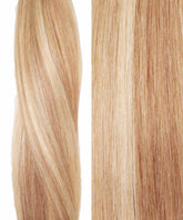 Close-up of straight, shiny blonde hair with champagne-highlighted extensions, shown twisted and smooth to display texture and color.#color_champagne-highlights-(18A/18/60)
