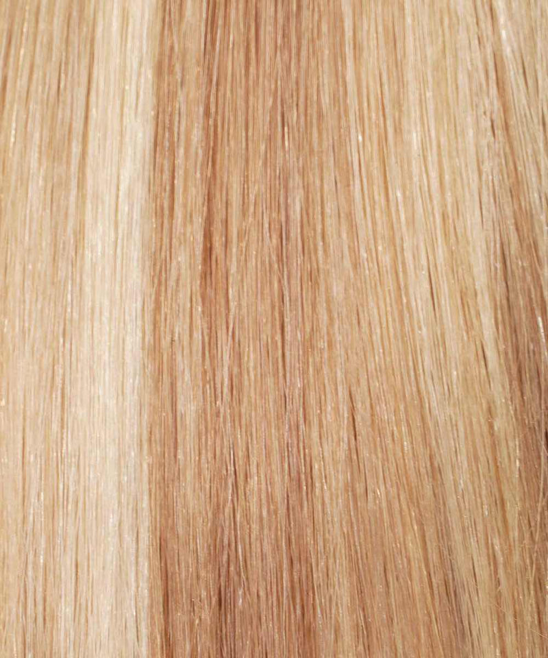 Close-up of Straight Invisi Tape In Hair Extensions by Perfect Locks, featuring champagne highlights and smooth texture.