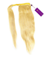 The Perfect Locks Straight Clip-In Ponytail Extension in Platinum Blonde with a yellow band and purple tag on white background.#color_platinum-blonde-(613)